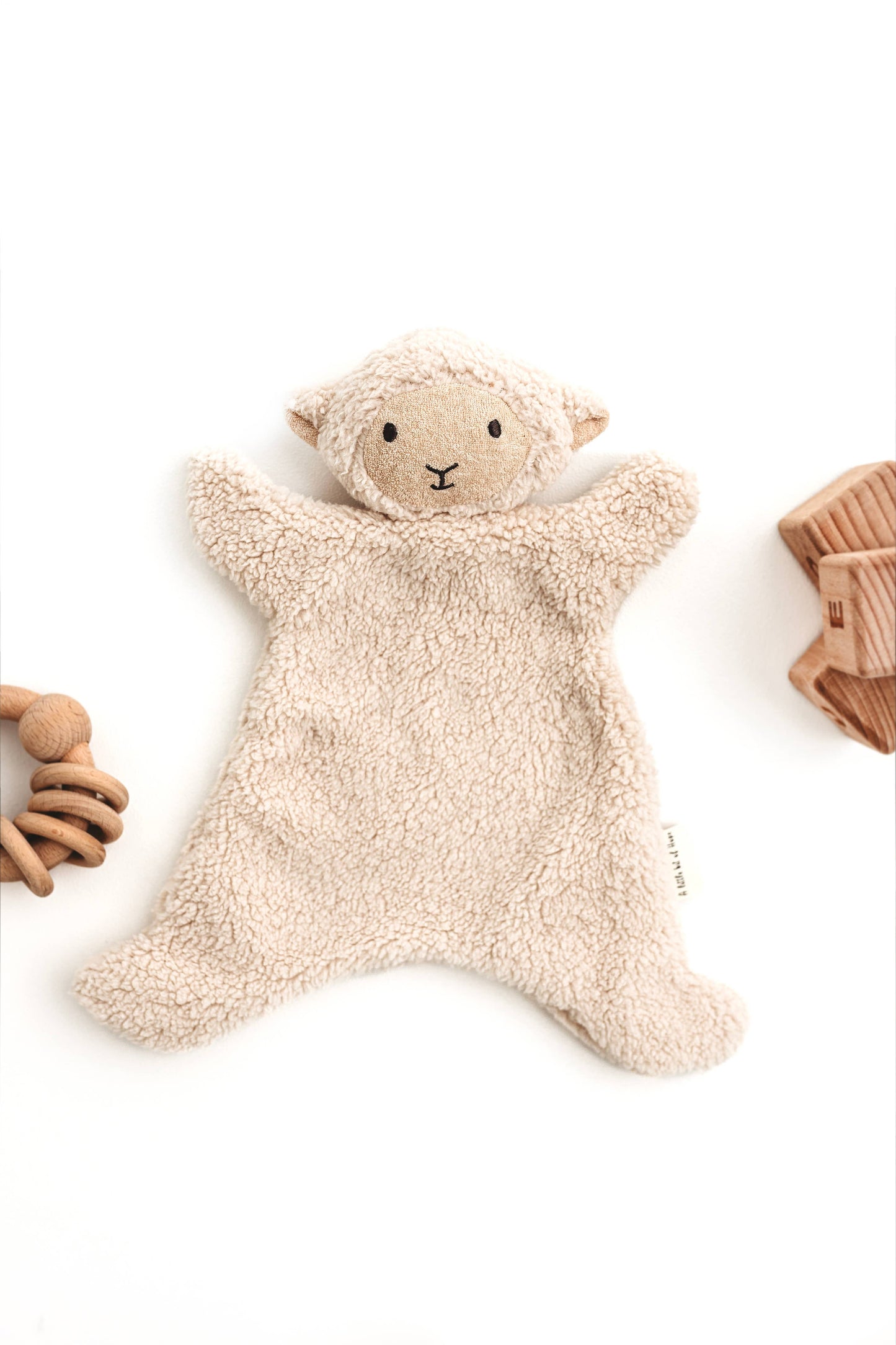 Cream sheep snuggle bear